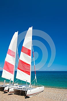 Two sailing catamarans on the beach in Kemer, Turkey