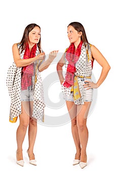 Two same women in studio on white background