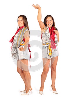 Two same women wearing in shorts dance in studio