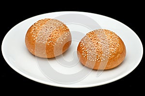 Two sandwich buns with sesame