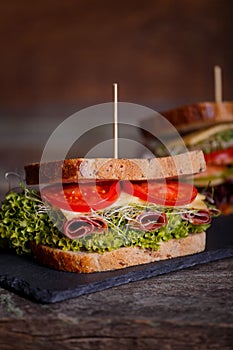 Two Sandwiches with cereals bread with lettuce,ham