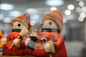 Two Santa claus happy smiling statue standing together and hold