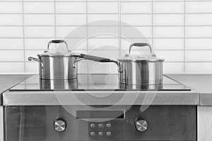 Two saucepans on electric stove