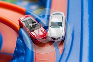 Two scale model toy cars accident on the road. Traffic jam. Stupidity. photo