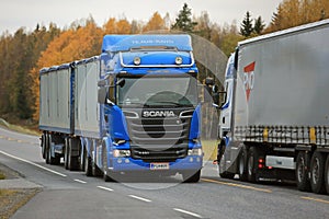 Two Scania Trucks Meet on the Road