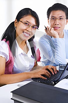 Two scholars smiling to camera