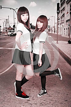 Two schoolgirls outdoors. photo