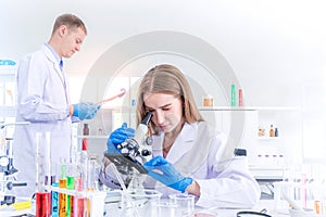 Two scientists researching for some confidential in chemical laboratory