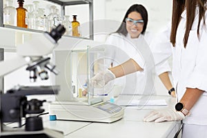 Scientists working with lab equipment in a laboratory