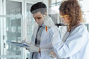 Two scientists working together in chemical laboratory