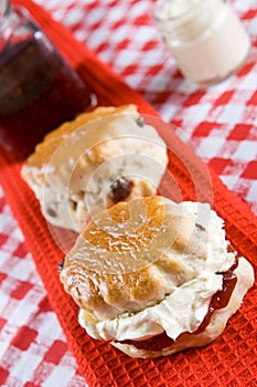 Two scones with clotted cream photo