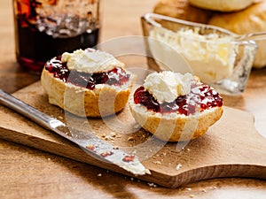 Two scones with clotted cream and jam