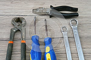 Two Screwdrivers, Two Wrenches, Two Pliers on Desk