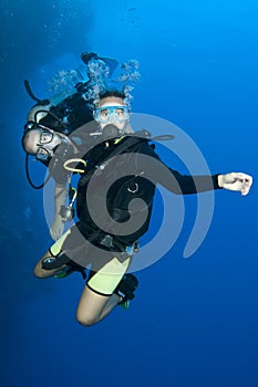 Two scuba divers enjoy a happy dive together