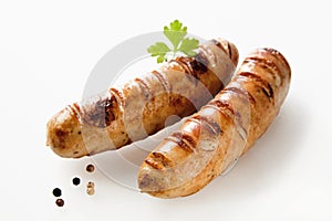 Two seared barbecued bratwurst with copy space