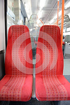 Two seats on a commuter train