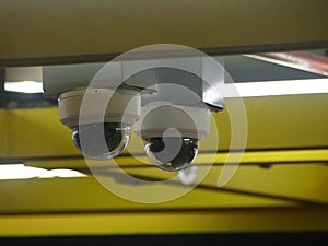 Two security cameras dome type install on the ceiling