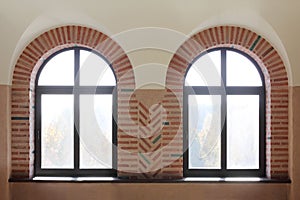 Two semi-antique round topped casement windows photo