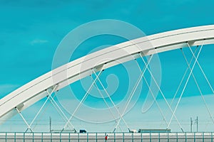 Two semi-truck crossing the bridge over Danube river