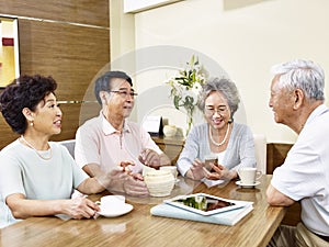 Two senior asian couple chatting