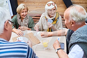 Senior Friends Playing Cards