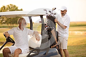 Two senior men golfers on court. Men preparing for golf