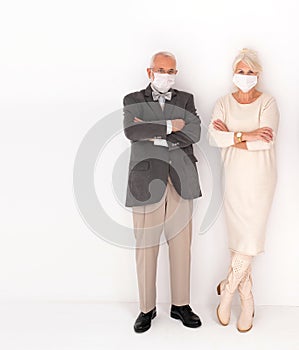 Two of senior people posing with face mask covered