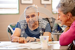 Two Senior Woman seated at table