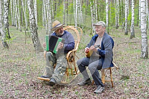 Two seniors playing music