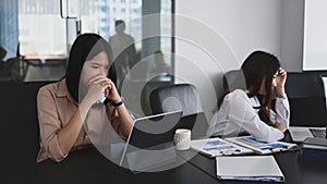 Two serious businesswomen colleagues having disagreement  in office.