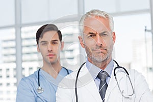 Two serious doctors standing