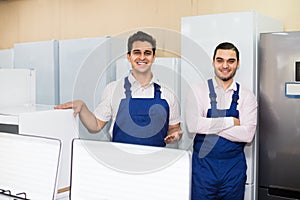 Two servicemen smiling at shop