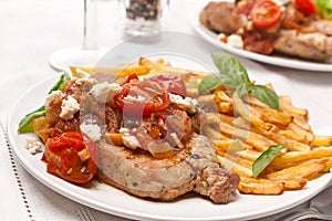 Two Servings of Pork Chops with Fries photo