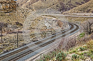Two Sets of Tracks Curving Through a Canyon