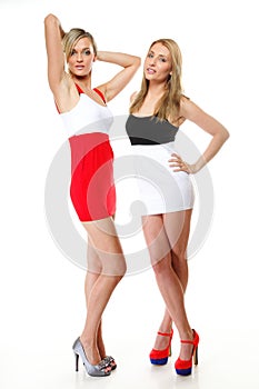 Two women wearing mini skirts
