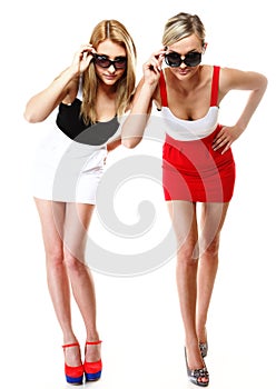 Two women wearing mini skirts