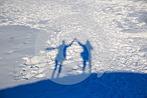 Two shadows on the snow.