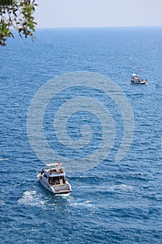 Two ships in mediterrian sea near shore of