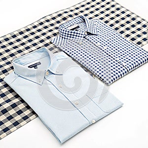 Two shirts are on a checkered surface isolated on transparent background