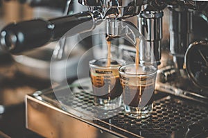 Coffee being made in Espresso Machine photo