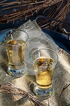 Two Shots of Gold Tequila on Burlap in Tin Tray