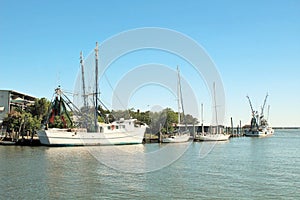 Two shrimp boats docked in Shem Creek, Charleston, South Carolina photo