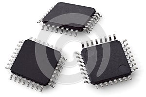 Two-side macro photo of a microcontroller chip in a TQFP-32 package on a white background.