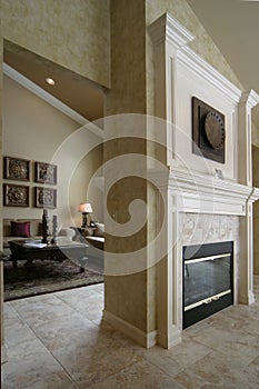 Two sided fireplace and living room photo