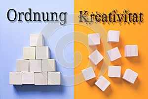 Two sides symbolizing with cubes a structured organization and a chaotic organization