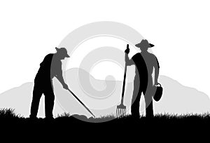 two silhouettes of farm workers working in the field using hand tools