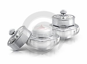 Two silver deluxe cosmetic jar on white