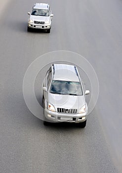 Two Silver luxury suv cars