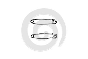 Two silver safety pins on white background