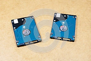 Two simple identical HDD hard drives, objects closeup, nobody. Digital data storage, media backup, copying files, storing